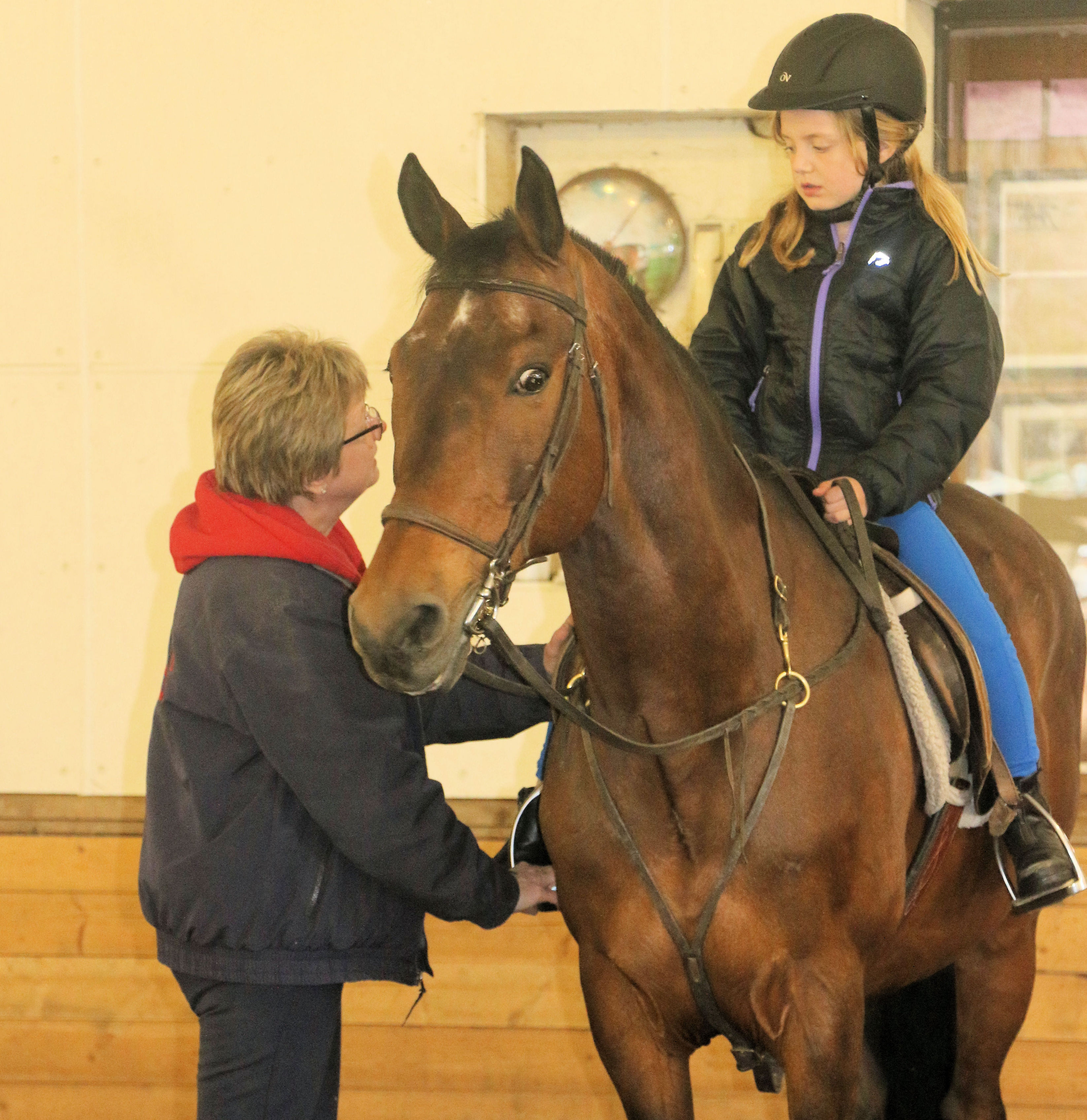 beginner rider in a lesson with riding instructor Deb Nichols