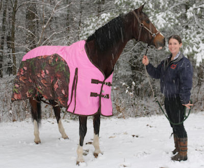 Chrislar boarder enjoying a walk around the property with her horse after a winter ride