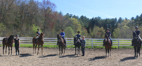 Chrislar students in a group riding lesson with riding instructor Sarah Keyes
