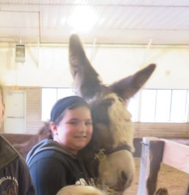 girl with a mini donkey