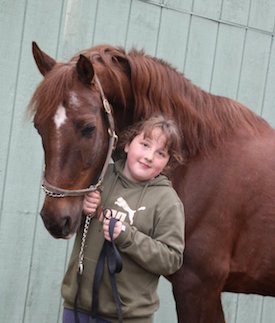 girl with horse at camp day